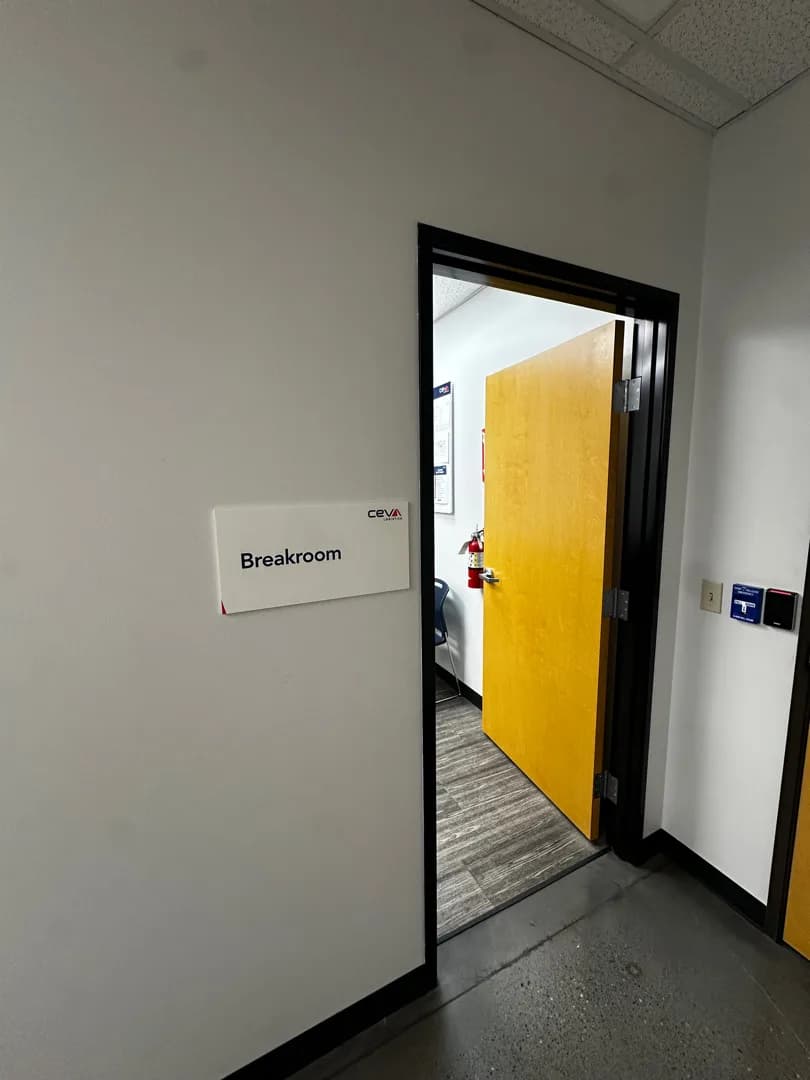 CEVA room identification sign installed beside an office doorway