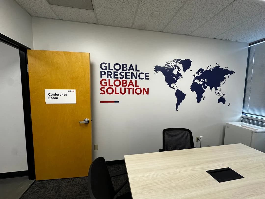 CEVA office sign installed on a wooden door
