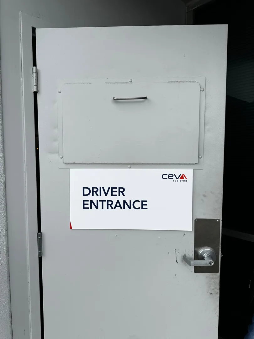 CEVA driver entrance wayfinding sign