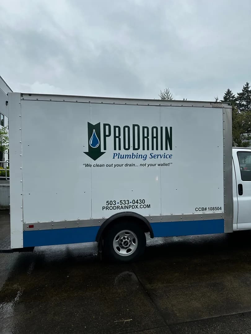 Pro Drain logo and contact graphics installed on the box truck side
