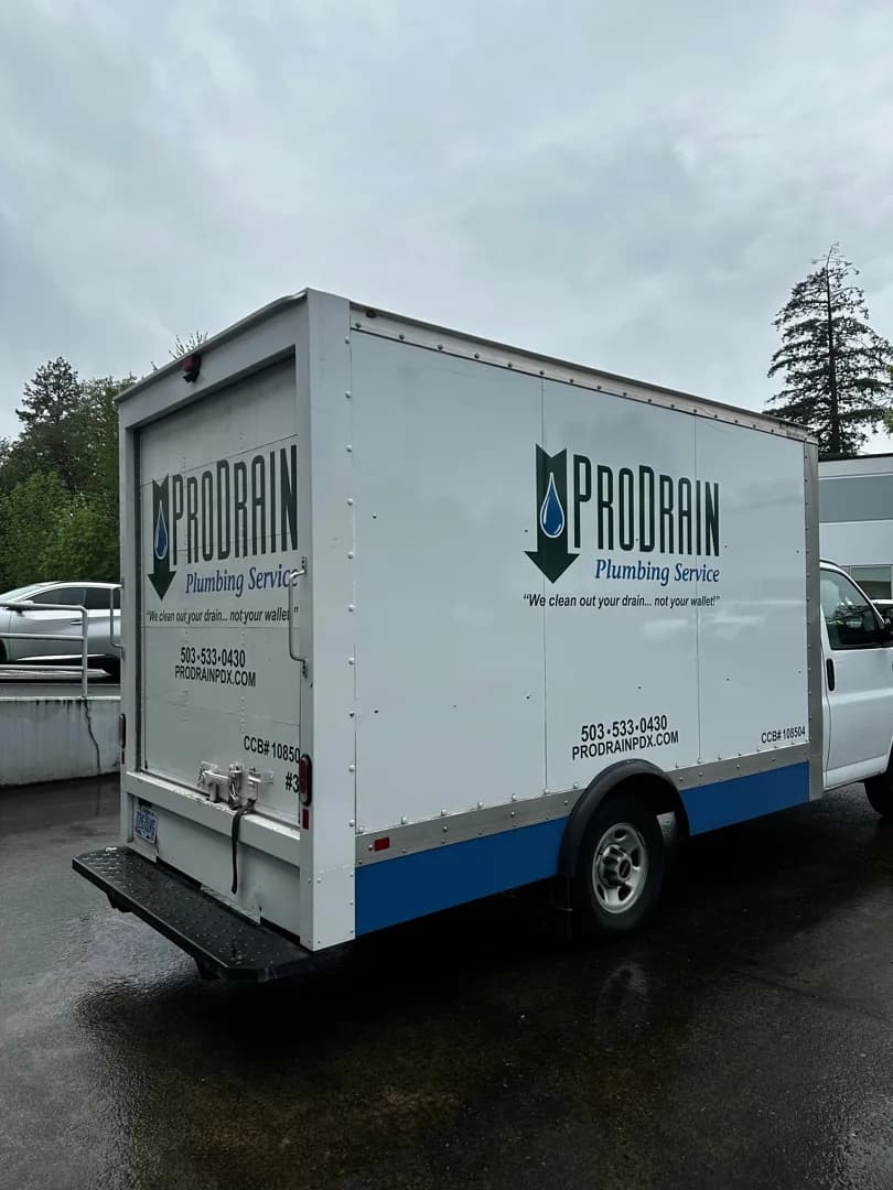 Angled rear view of the completed Pro Drain fleet graphics