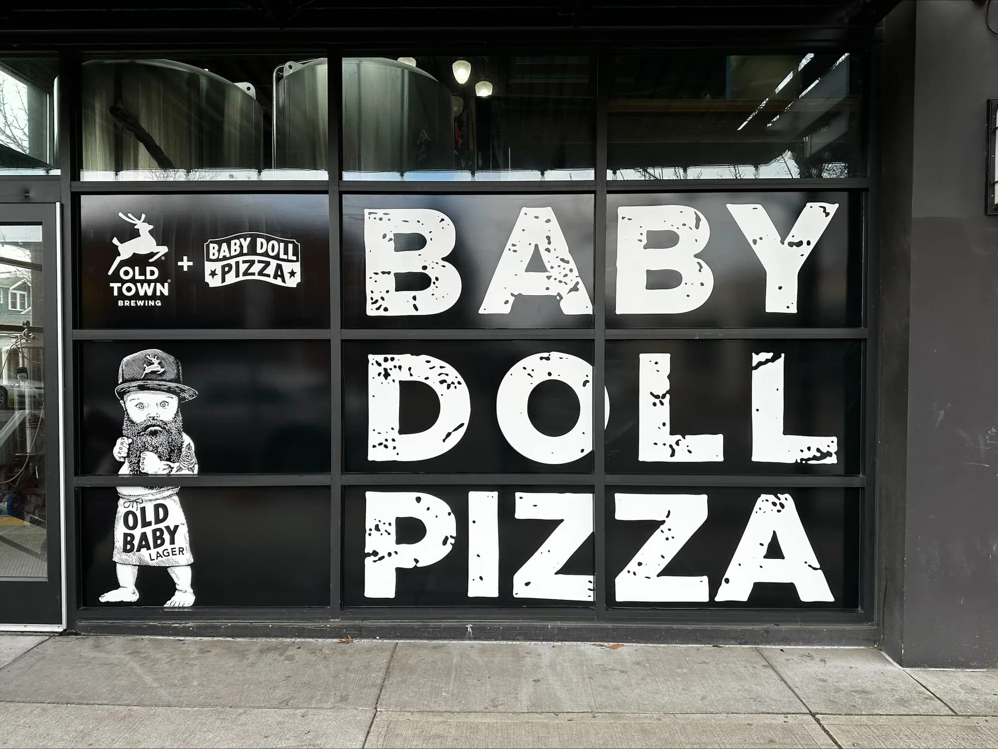 Completed Baby Doll Pizza and Old Town Brewing storefront window graphics