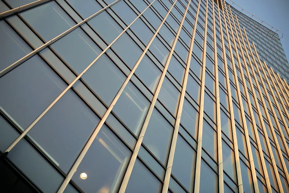 Modern building with reflective glass panels showcasing professional window graphics