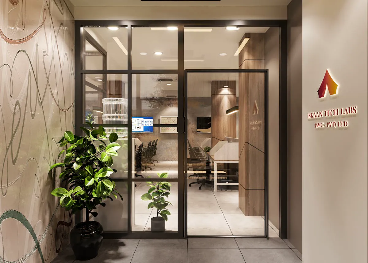Stylish office entrance featuring branded signage and professional graphics installation