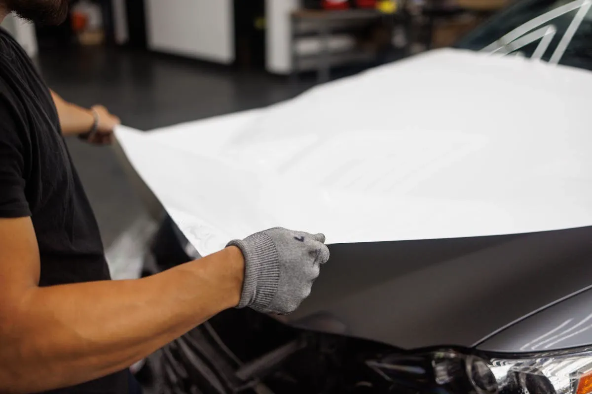 Car surface being prepped for vinyl wrap installation