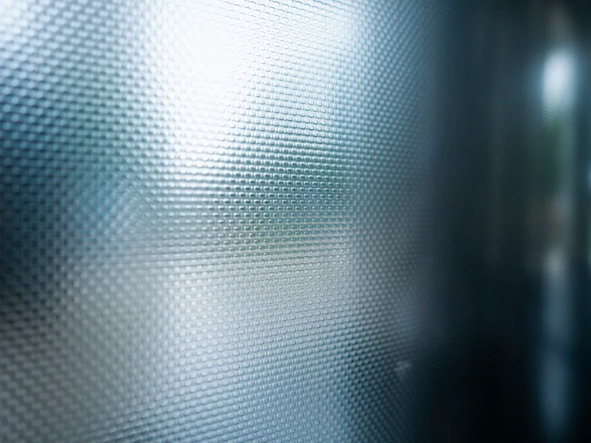 Frosted glass panel providing elegant privacy in a commercial office setting