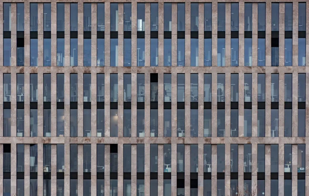 Modern commercial building with glass windows ready for vinyl graphics
