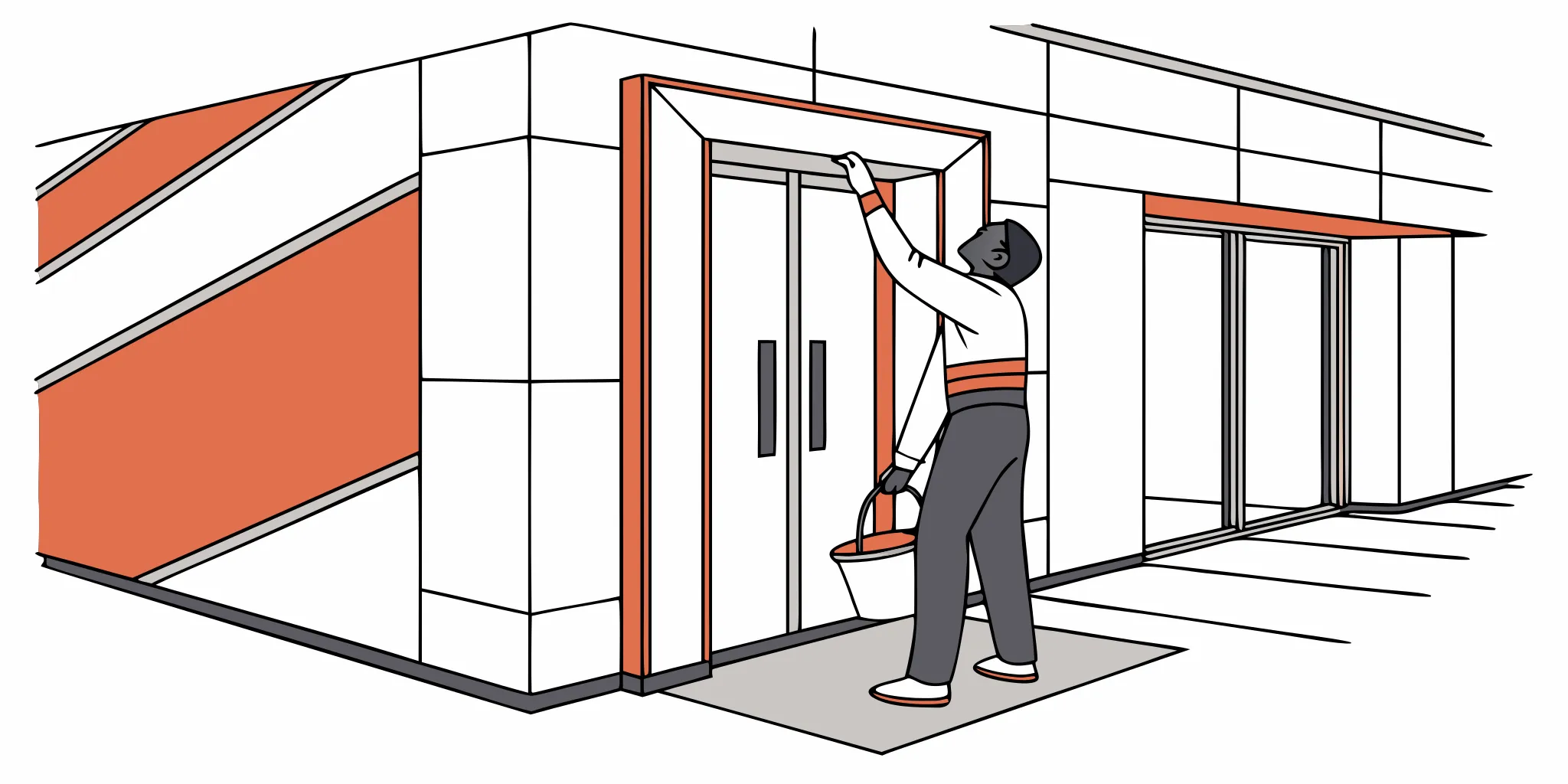 Professional installer applying vinyl graphics to commercial elevator doors
