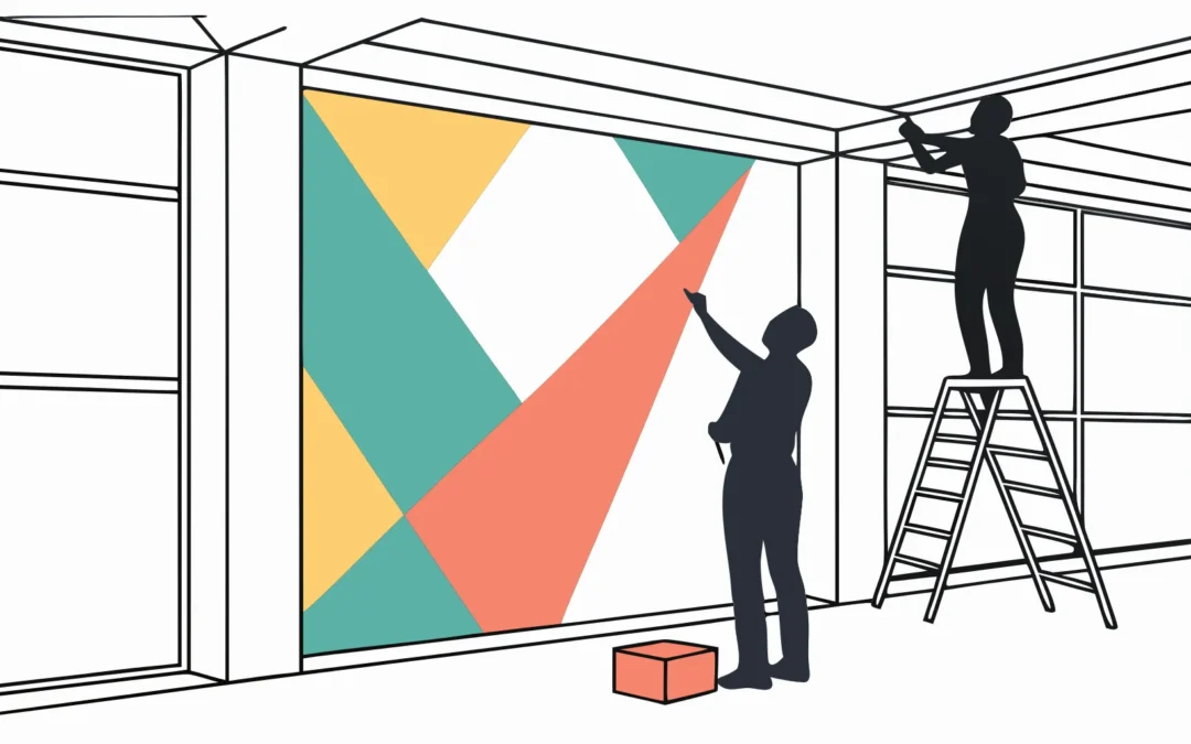 Experiential graphics installer team completing a colorful, geometric wall installation.