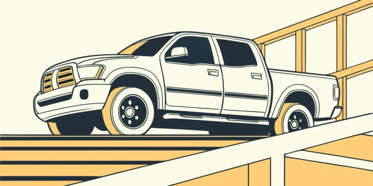 A truck with a custom wrap for branding and paint protection drives up a ramp in Austin.