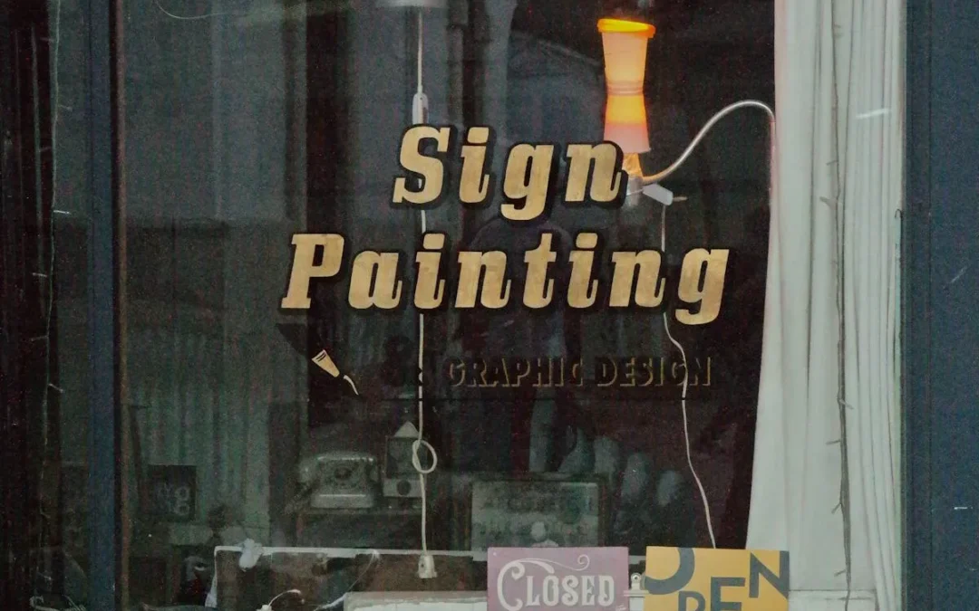 Business window graphics on a commercial storefront showcasing brand identity