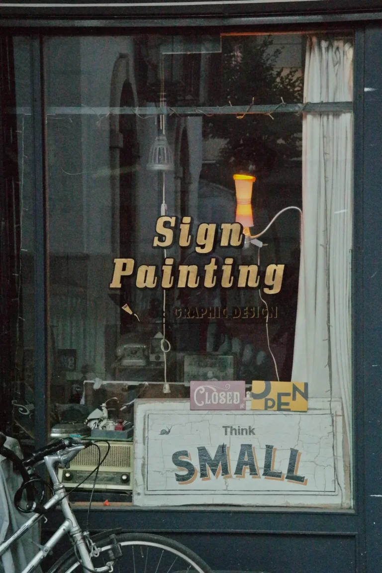 Business window graphics on a commercial storefront showcasing brand identity