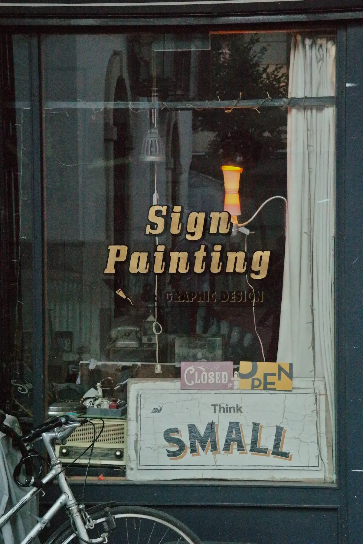 Business window graphics on a commercial storefront showcasing brand identity