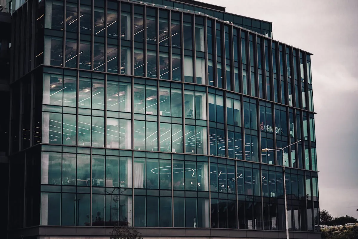 Modern commercial building with glass facade windows, ideal surfaces for professional business window graphics in Portland