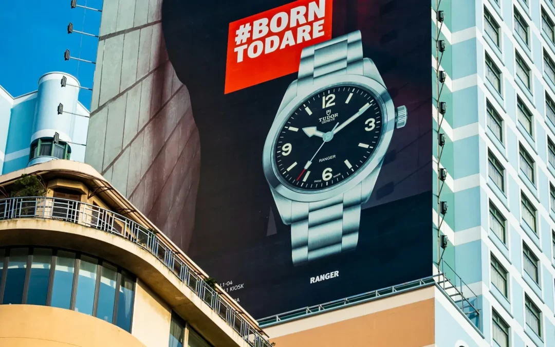 Fleet of branded commercial vehicles with professional vinyl wrap graphics parked at a business facility