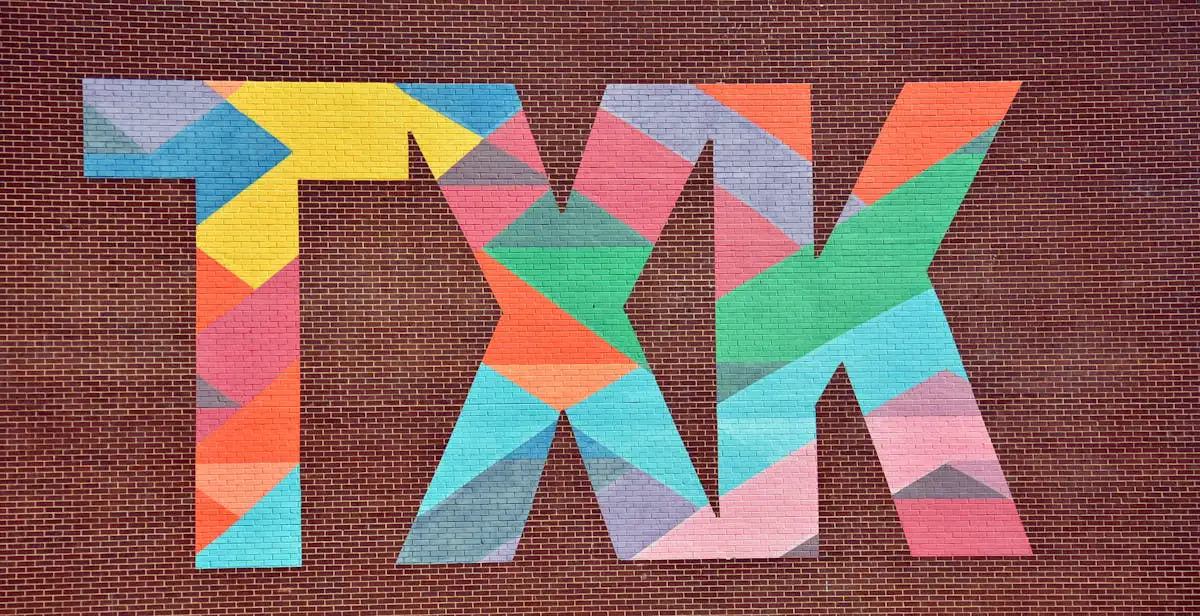 Vibrant geometric mural on a red brick wall demonstrating creative experiential design