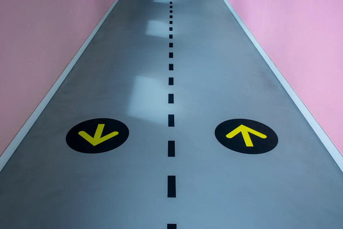 Colorful directional floor graphics in a retail corridor for wayfinding