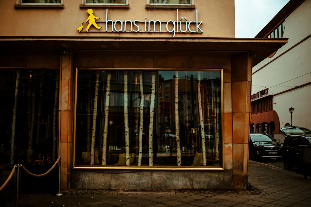 Modern commercial building with glass windows and storefront signage