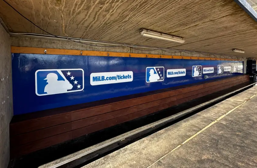 Hillsboro Hops dugout sponsorship signage installation by AP Installations