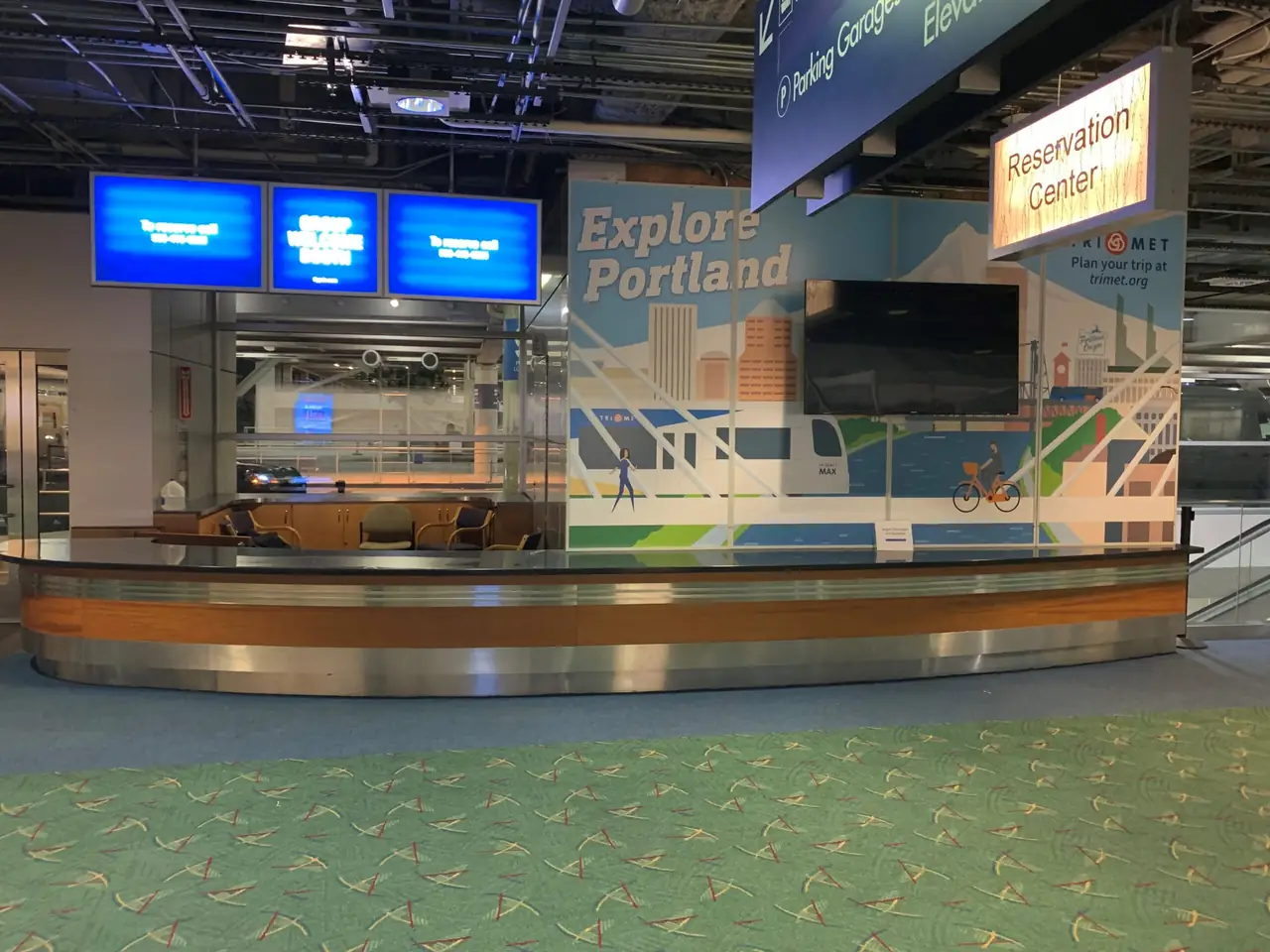 TriMet transit vehicle wrap and airport wallscape installation by AP Installations